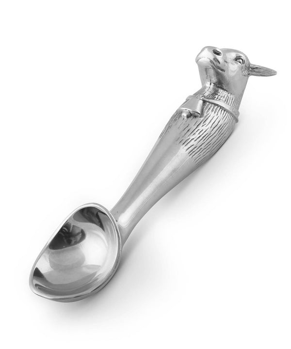 Silver ice cream scoop with cow head on the end of it 