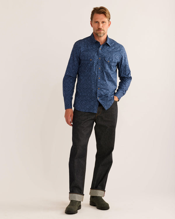 Man wearing blue Aztec pattern shirt with double breast pockets