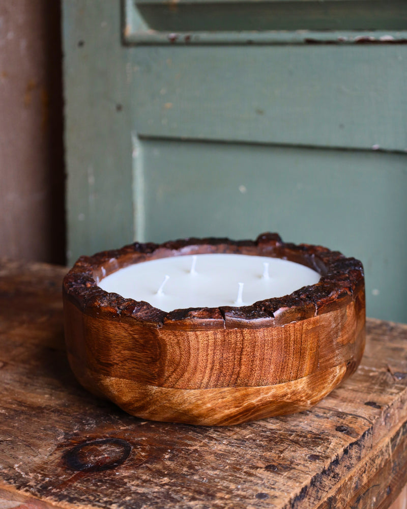 Candle in a mango wood bowl