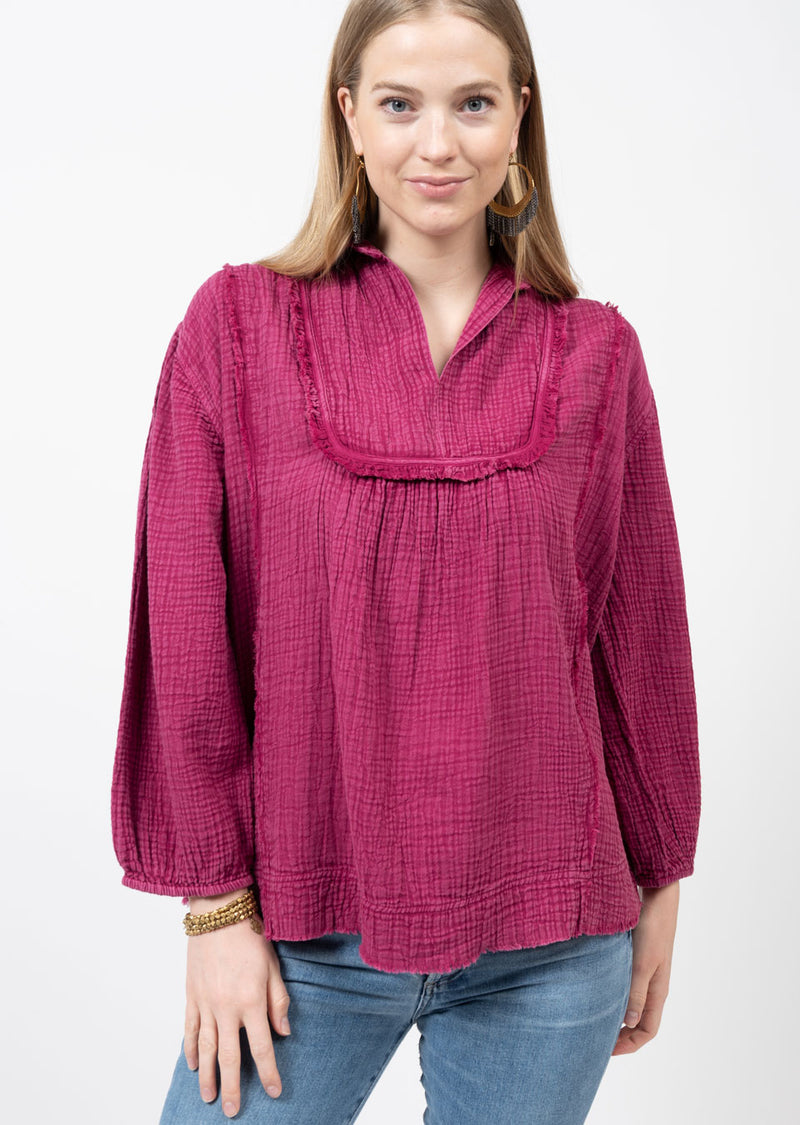 Woman wearing gauze berry blouse