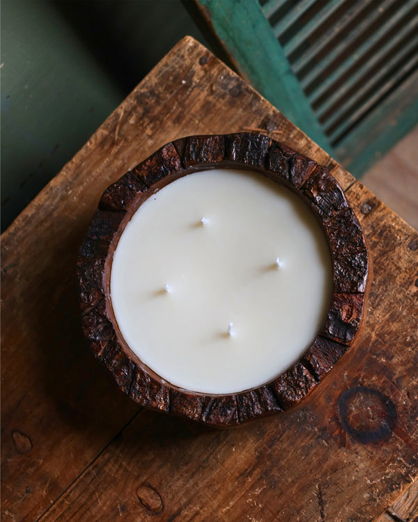 Candle in a mango wood bowl