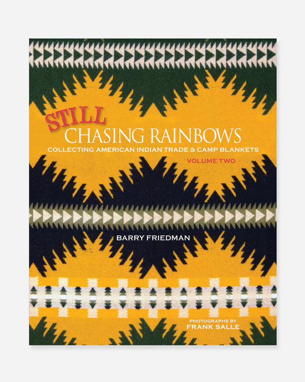Book with Aztec patten on cover with words "Still Chasing Rainbows Collecting American Indian Trade & Camp Blankets Volume Two" on the front