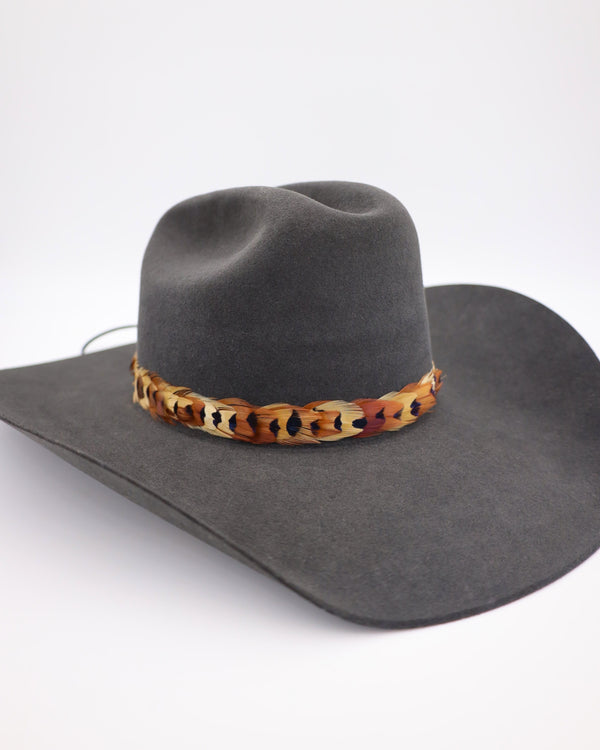 Pheasant feather hat band with leather strings to attach in the back