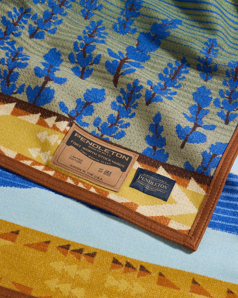 Close-up of a Pendleton blanket with a tree pattern and brand label.