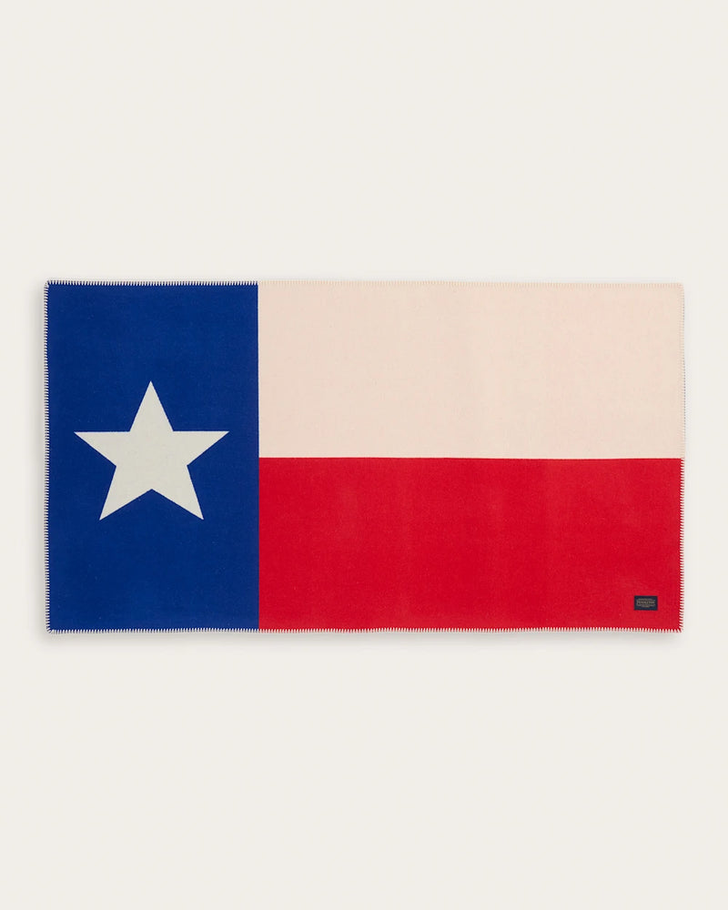 Texas flag design on a blanket with a white background