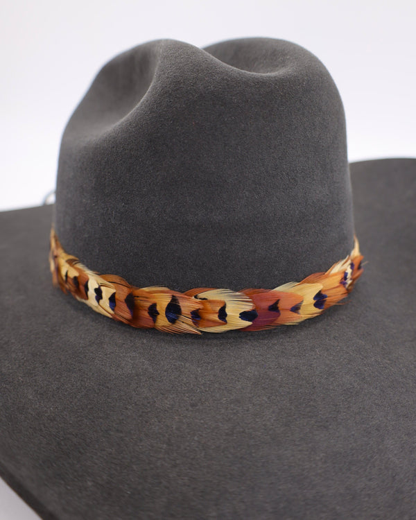 Pheasant feather hat band with leather strings to attach in the back