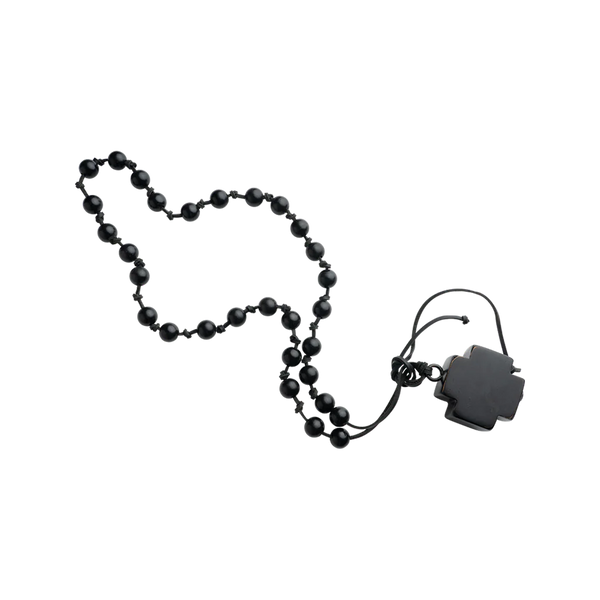 Black beaded necklace with a black clasp on a white background