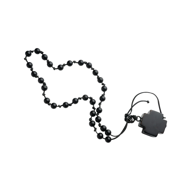 Black beaded necklace with a black clasp on a white background