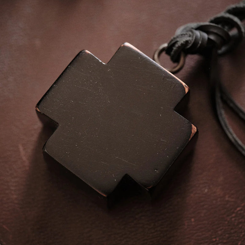 Brown leather pendant on a brown background