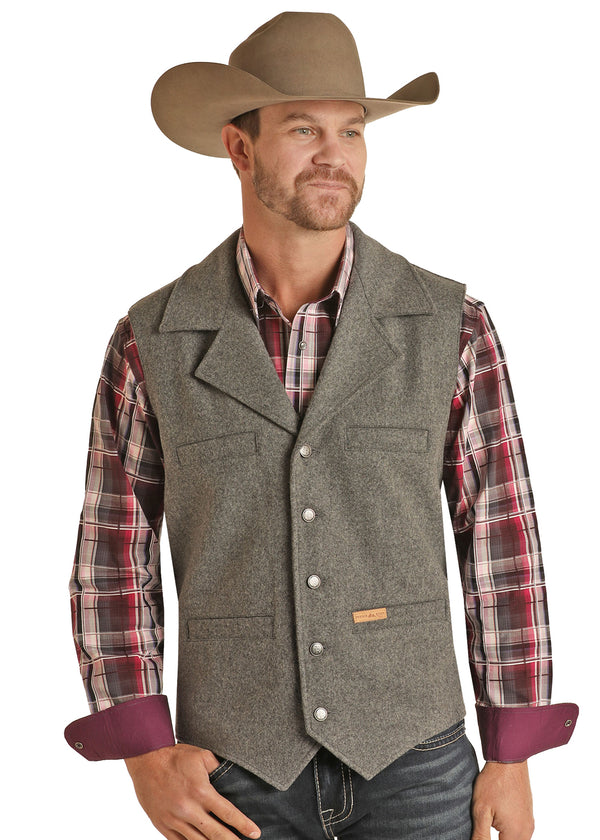 MAN WEARING WOOL BUTTON UP LIGHT GREY VEST WITH FOUR POCKETS ON THE FRONT 