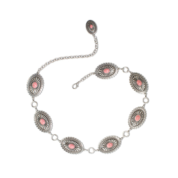 Women's belt with conchos all over and pink stones in the center of the conchos 