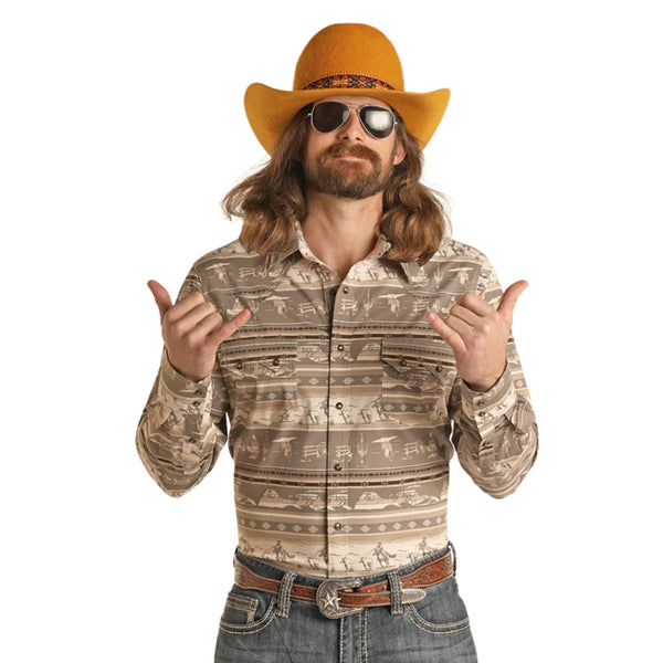 Man wearing Aztec and cowboy pattern button down shirt with double snap breast pocket