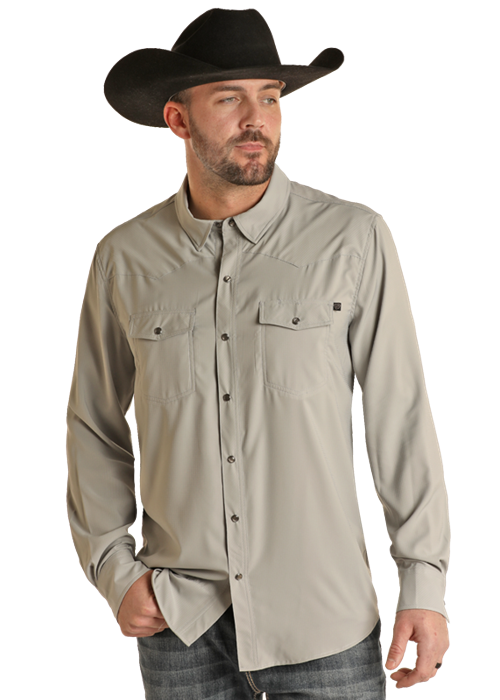Man wearing solid grey button down shirt with double breast pocket