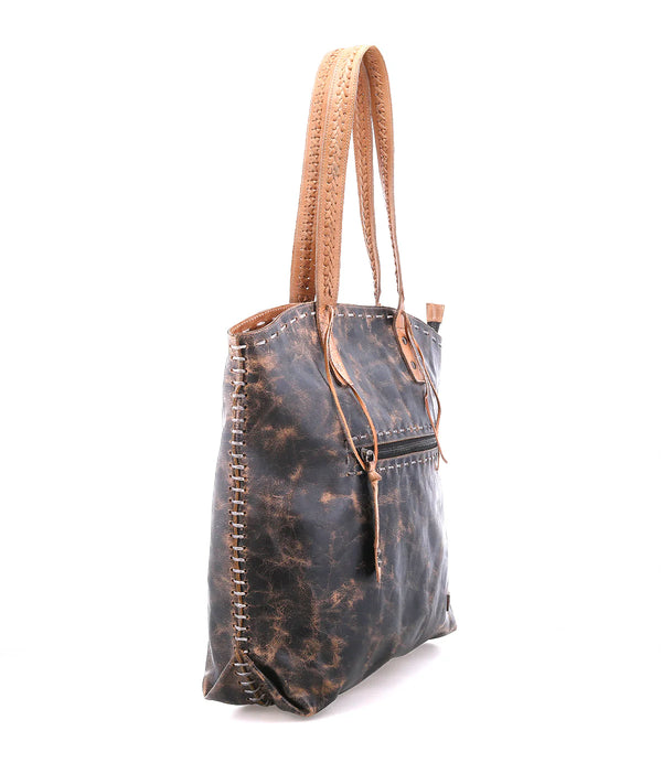 Brown leather tote bag with distressed finish on a white background