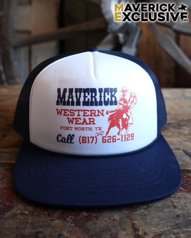 Trucker hat with 'Maverick Western Wear' branding on a wooden surface.