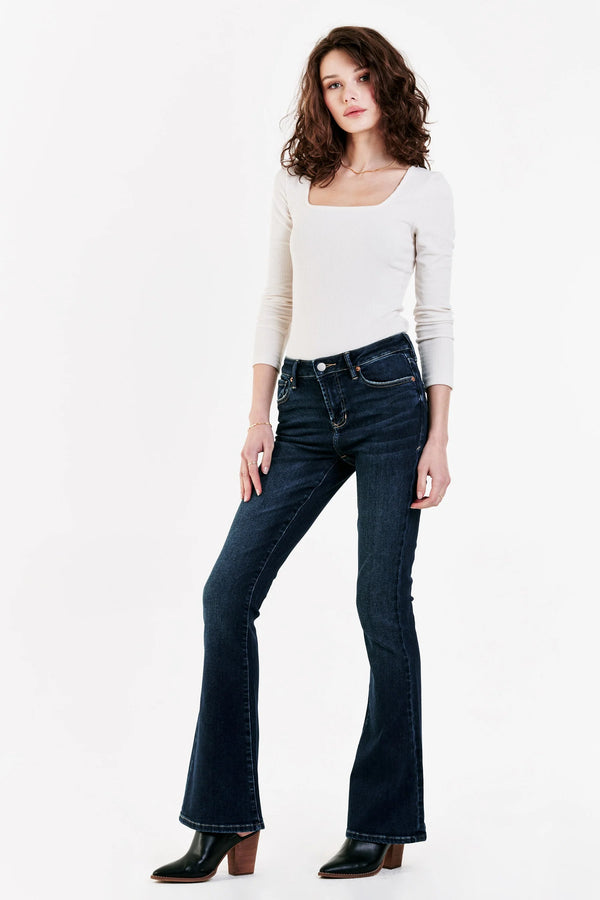 Woman wearing high rise flare leg jeans