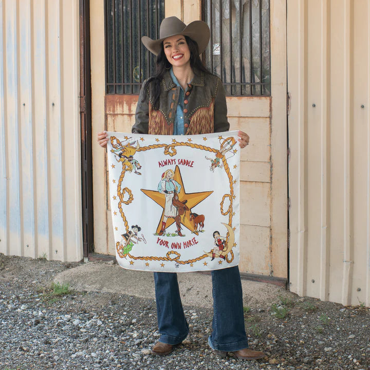Vintage inspired graphic of a woman holding a saddle with words "always saddle your own horse" on a wild rag