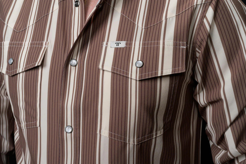 Close-up of a brown and beige striped shirt with button details