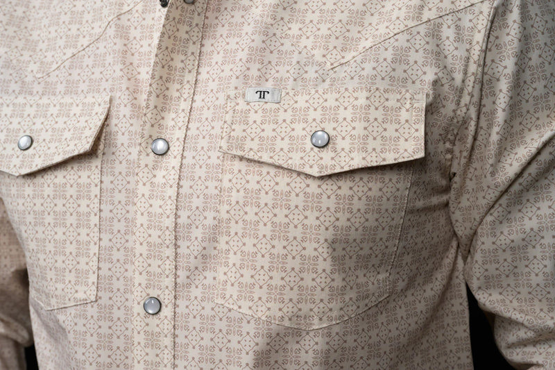 Close-up of a beige patterned shirt with button details