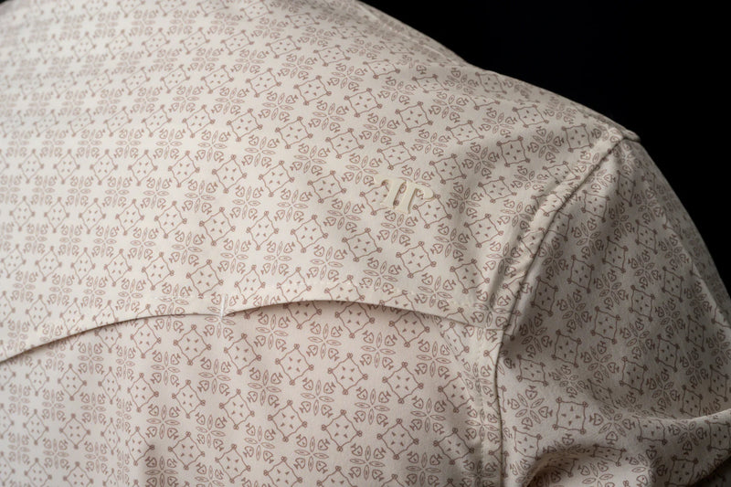 Close-up of a patterned shirt with a black background