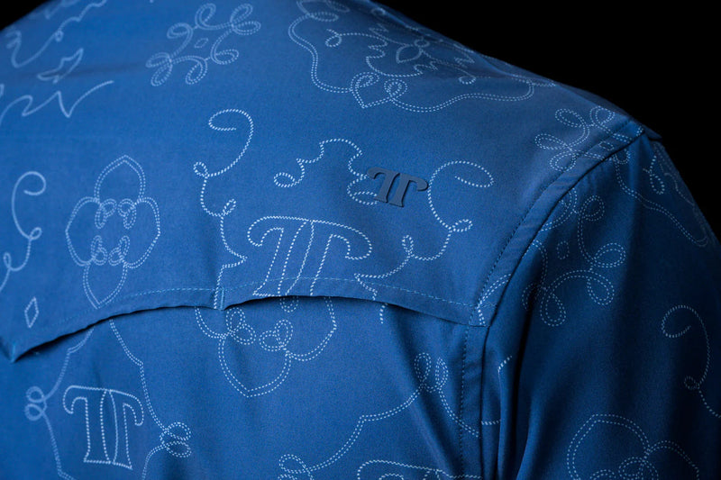 Blue shirt with white pattern and logo on a black background