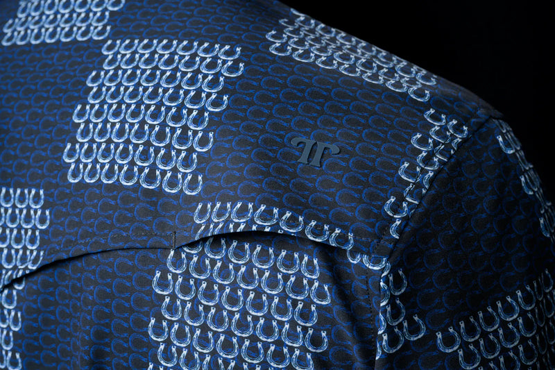 Close-up of a blue textured fabric with a pattern on a black background