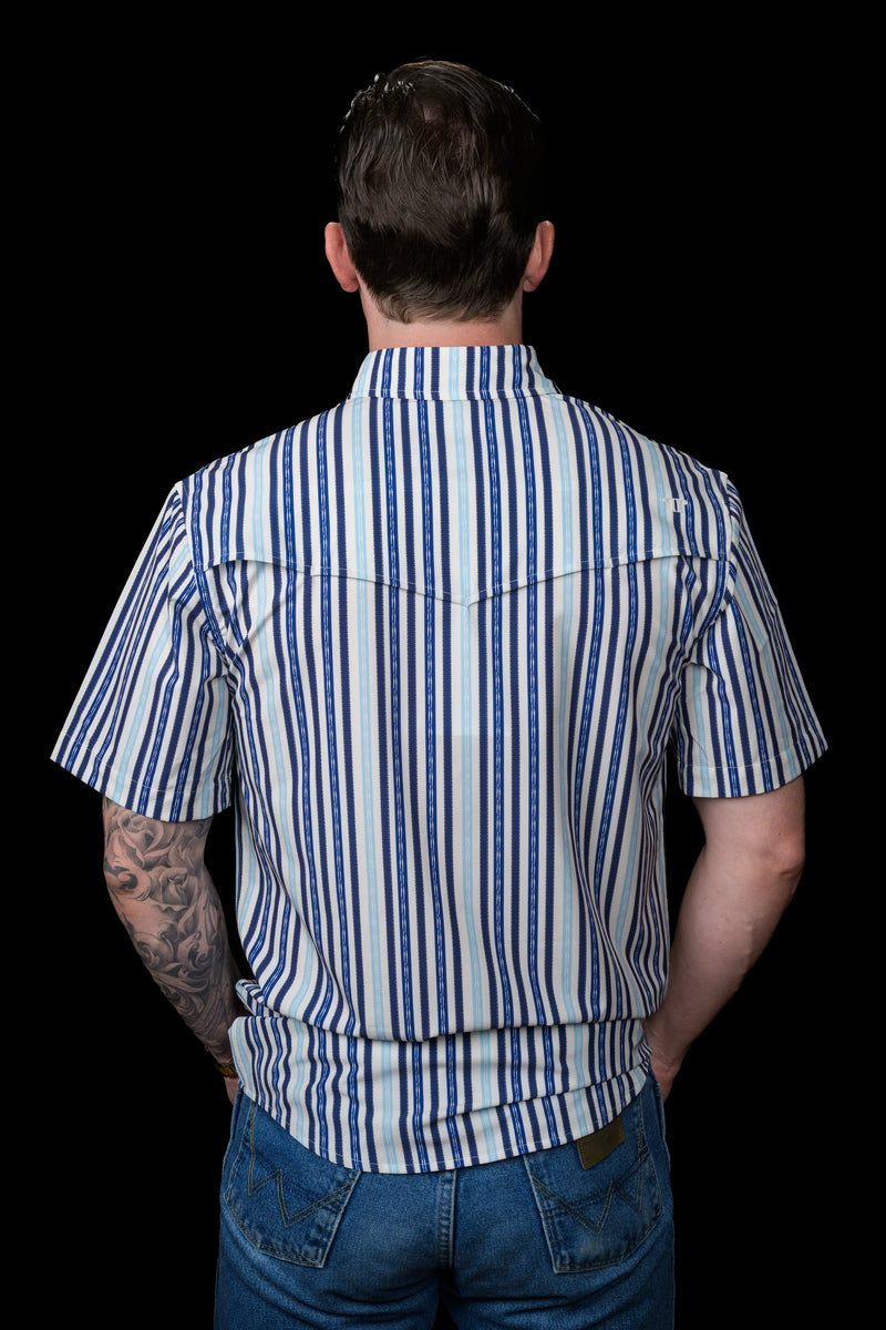Person wearing a blue and white striped shirt with a black background