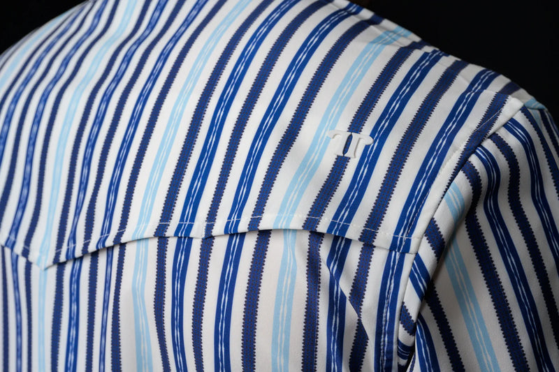 Close-up of a blue and white striped fabric with a black background