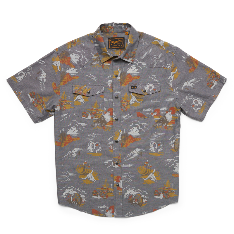 Grey short sleeve shirt with images of cow skill, canyon, wagon wheel and cacti in orange, yellow and hazel colorway 