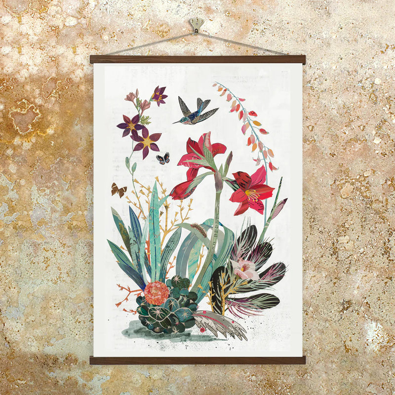 Archival print of an original paper collage featuring a hummingbird in flight surrounded by blooming summer flora including a cactus, butterflies and fuzzy caterpillar.