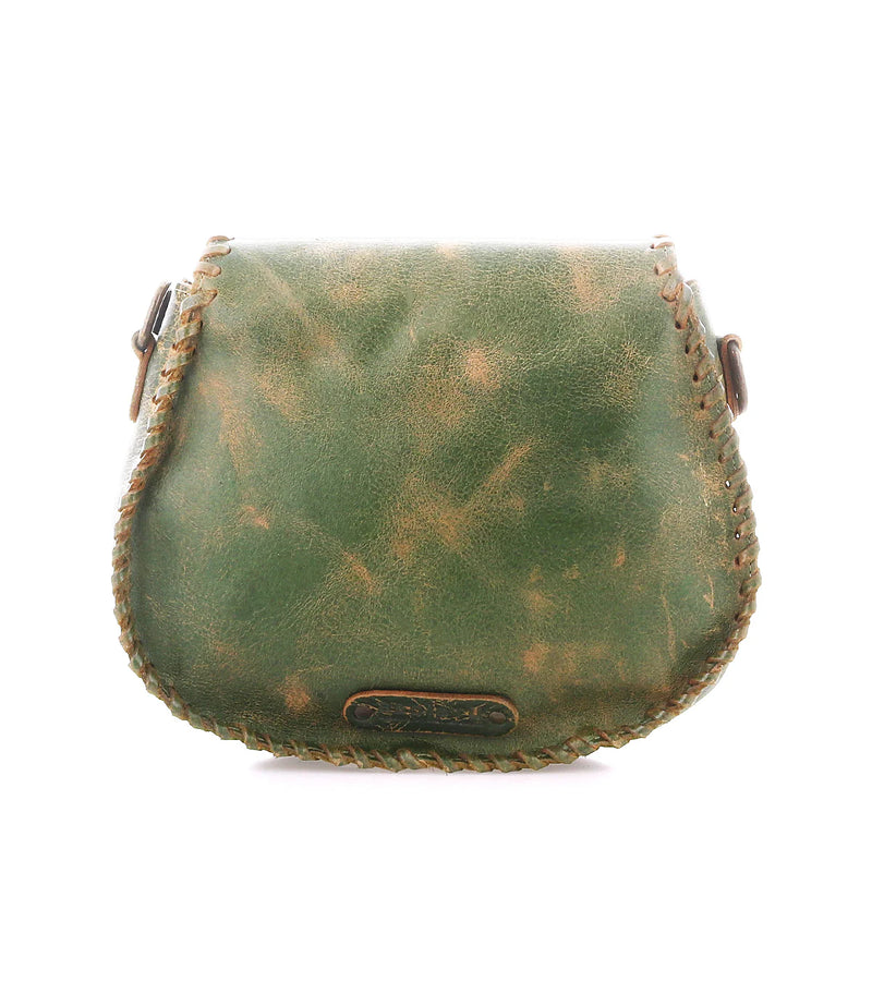 Vintage green leather bag with brown accents on a white background