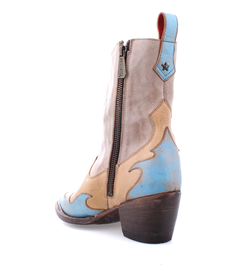 Bootie with pinkish tan hues with blue embellishments and a blue star on the front