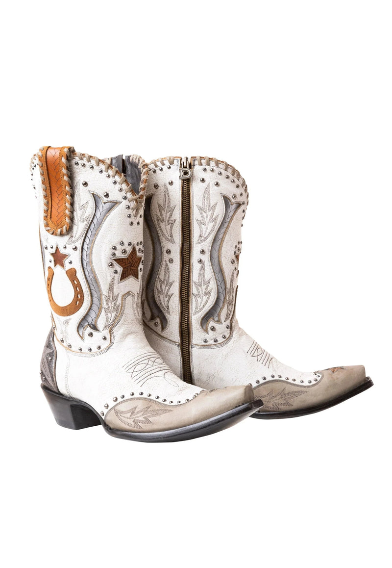 White cowboy boot with silver western accents with silver studs and brown pull tab and horse shoe and star on the side of the shaft