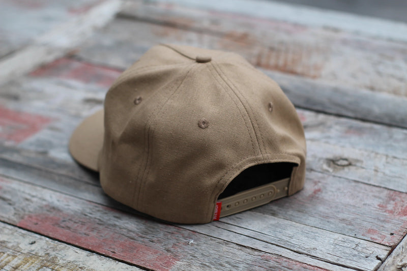 Brown cap on a rustic wooden surface