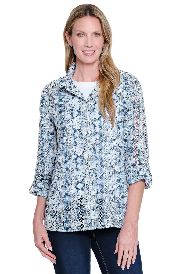 Woman wearing a floral patterned blouse on a white background