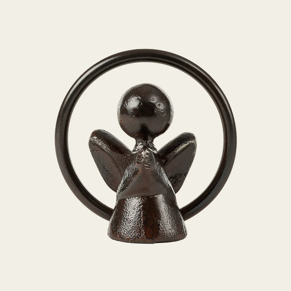 Cast iron angel with praying hands with outer ring surrounding the sculpture