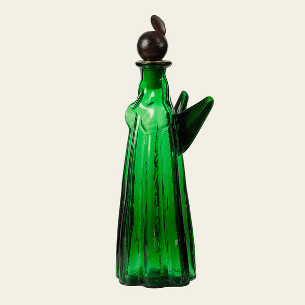 Glass angel in a green hue with cast iron angel head with halo attached