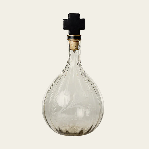 Glass decanter with leaves etched onto the side and cast iron with cork top and 