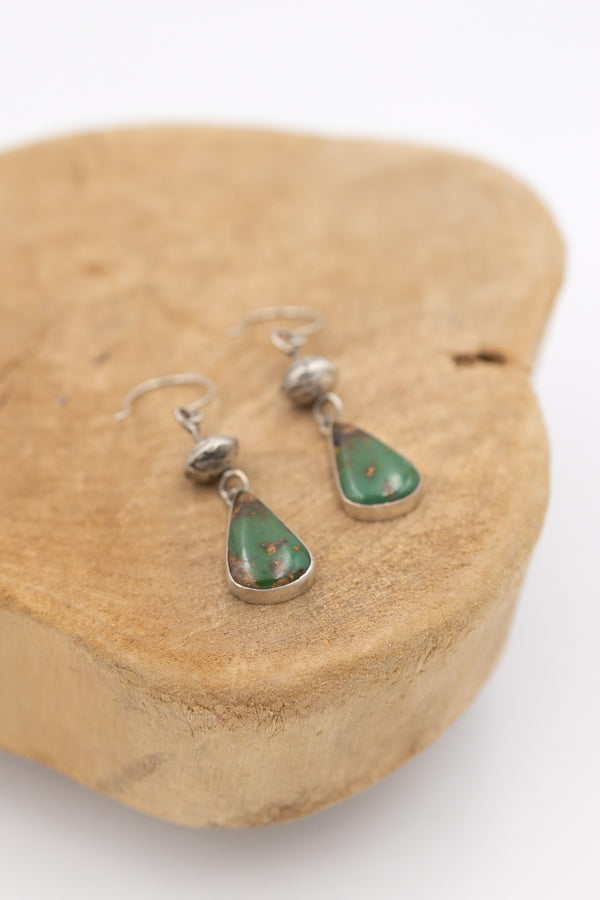 Beautiful turquoise accompanied by a sterling silver bead earring.