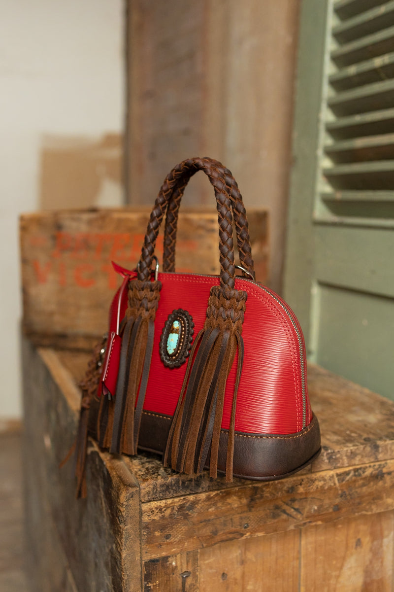 Red Nano Alma Bag featuring a 25 carat number eight turquoise oval embellishment and leather fringe braided detailing and fringe