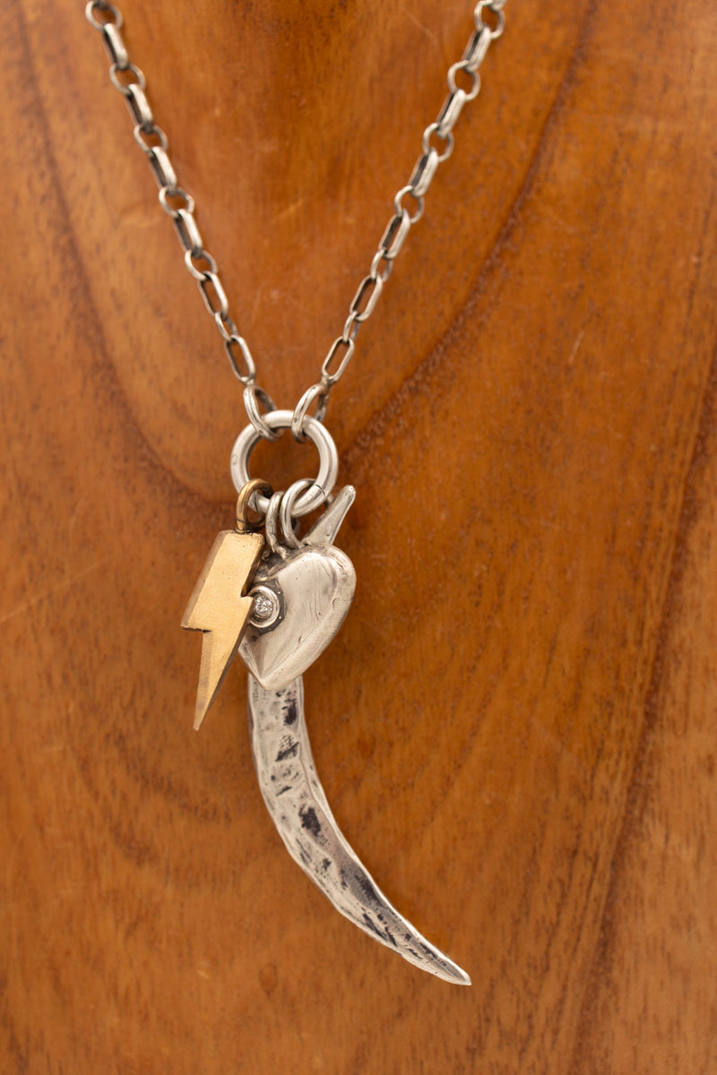 Bronze lightning bolt charm with display necklace and other charms
