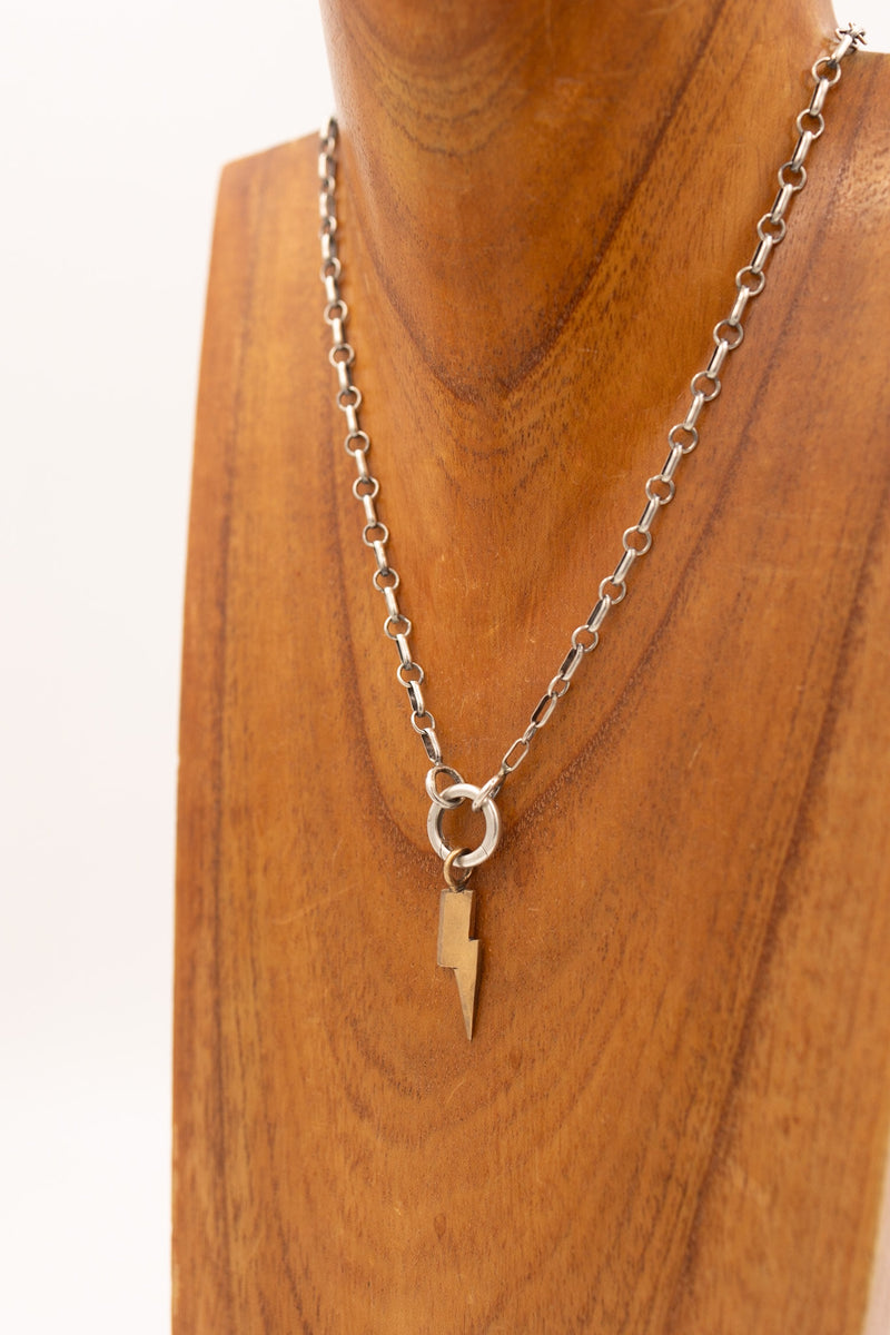 Bronze lightning bolt charm with display necklace