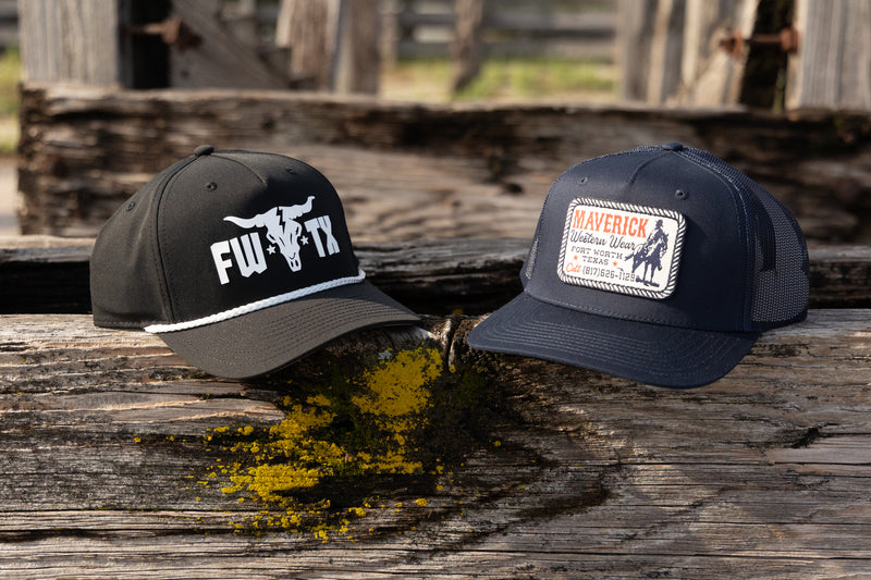 Two hats on a wooden surface with rustic background