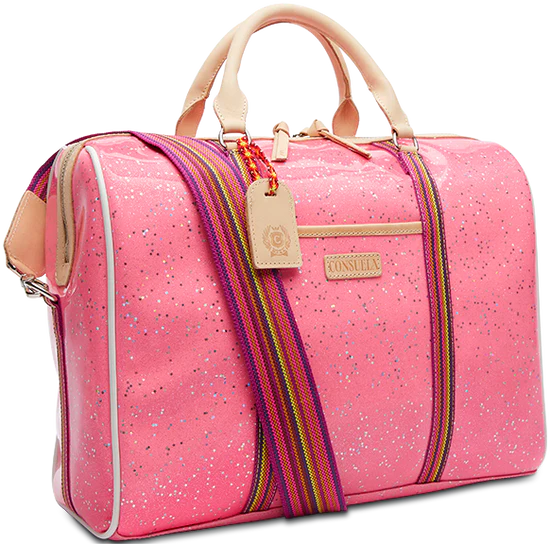 Topped with natural leather handles and an adjustable webbing strap, the Jetsetter is crafted to hold its shape and makes traveling easy with ample interior storage and functional pockets. The exterior is a shiny pink with silver metallic star sparkles all over