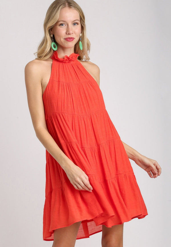 Red halter tiered dress with button on the neck and bow on the back