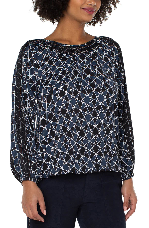 Women wearing square pattern shirt with blue, white and black 