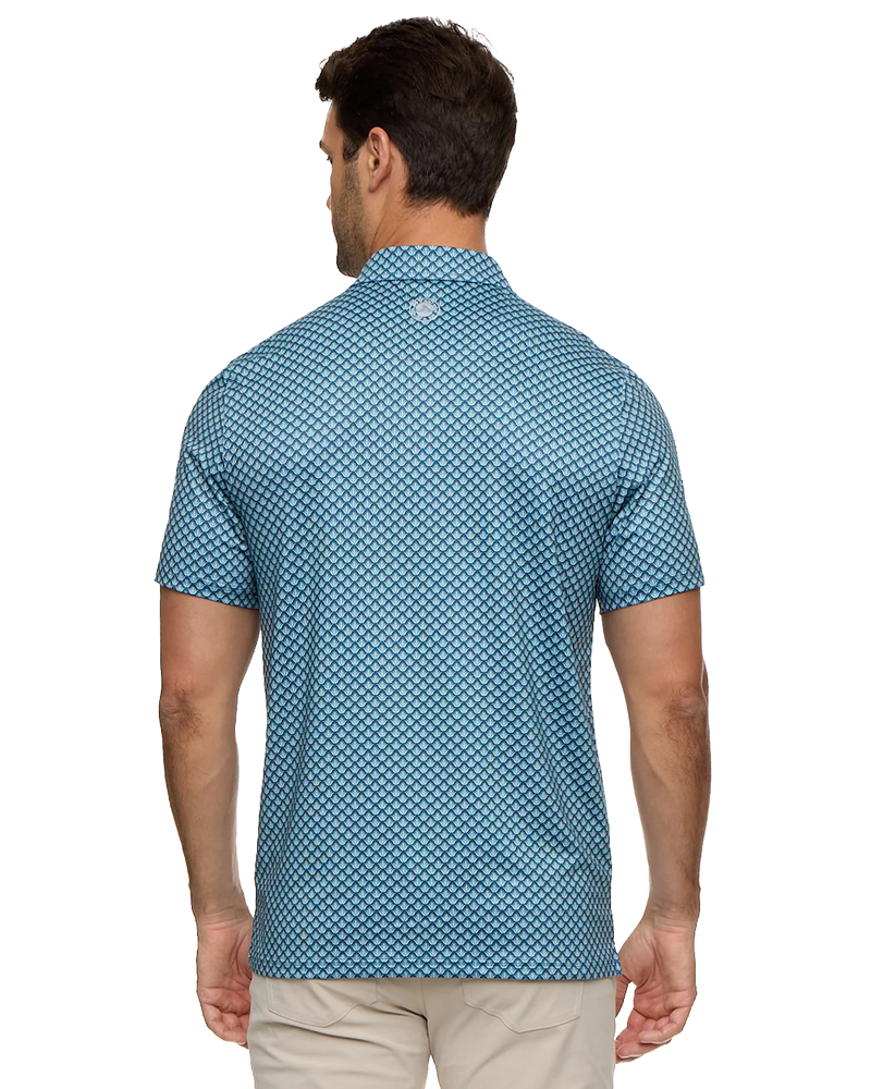 Man wearing a blue patterned polo shirt on a white background