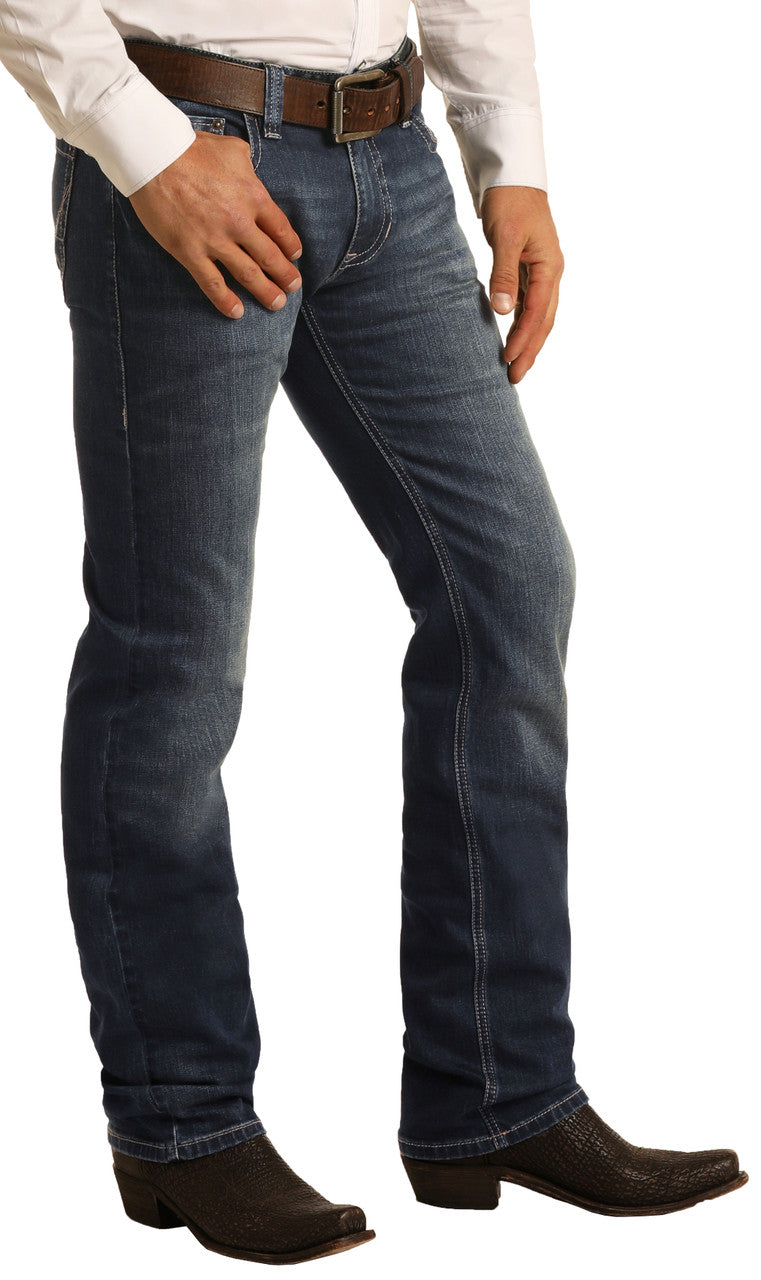 Man wearing dark boot cut blue jeans