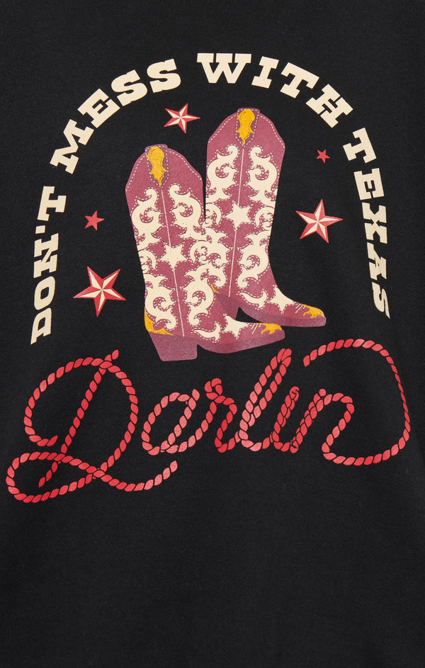 Black t-shirt with pink cowboy boots and text 'Don't Mess with Texas Darlin' on a black background