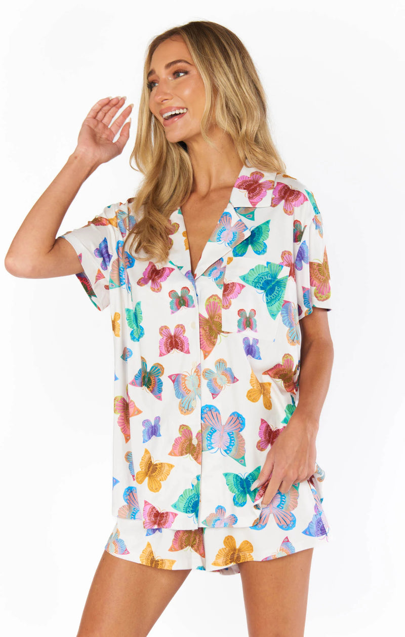 Woman wearing butterfly pajamas in multi color